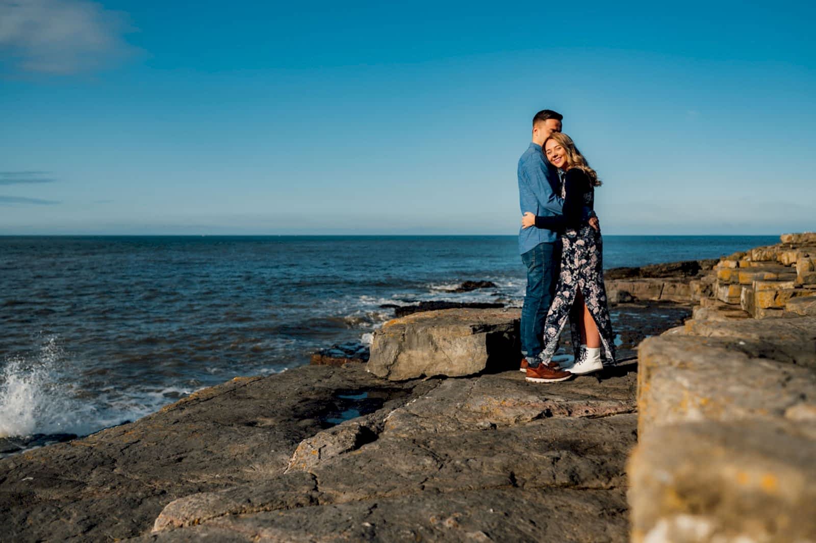 01 amy & Nathan having a cuddle near the sea