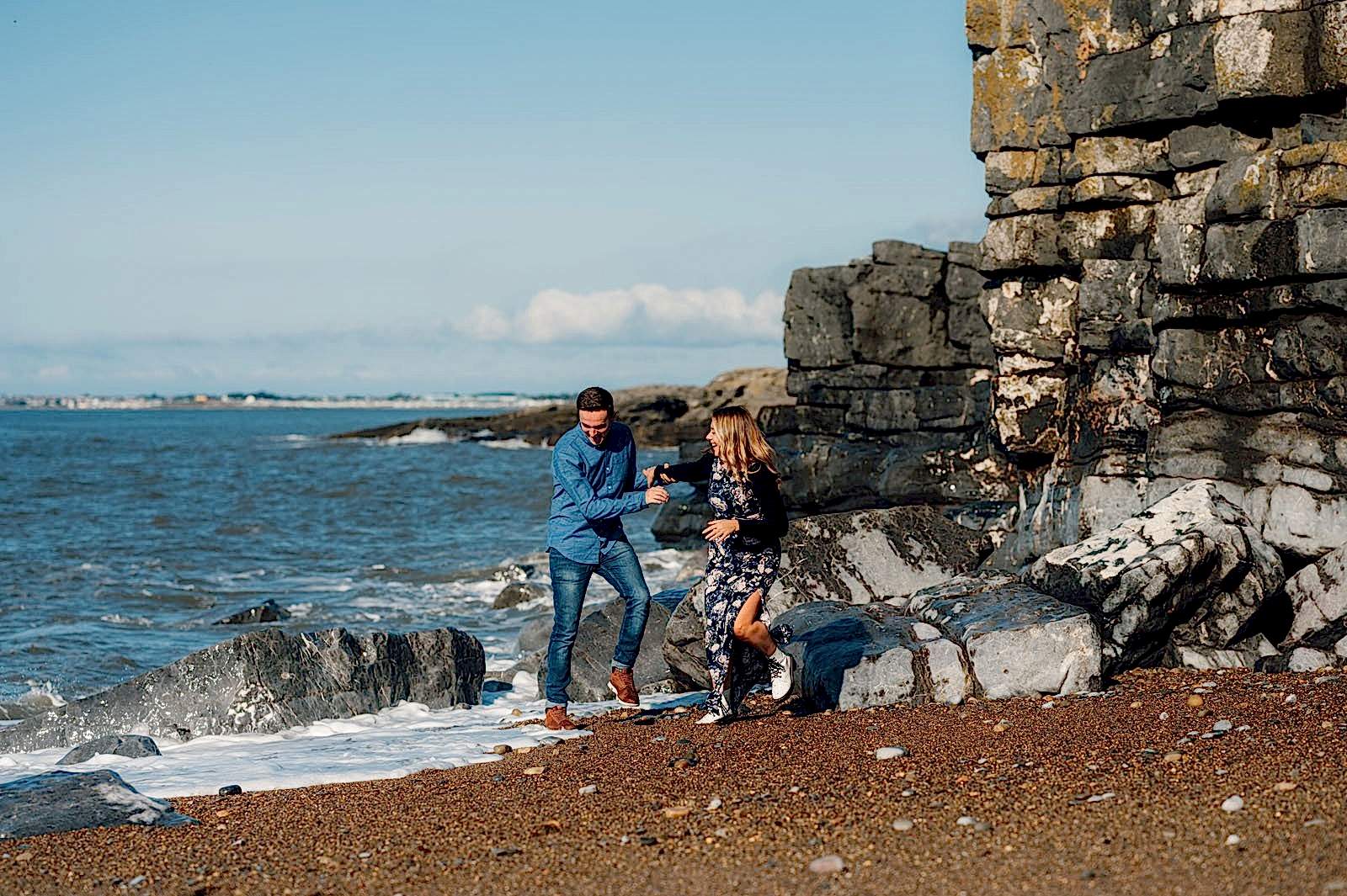 amy and nath runnign away from a big wave